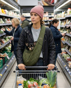 Rabbit- Daschund in black SUSU pet sling at outdoor farmers market and social events