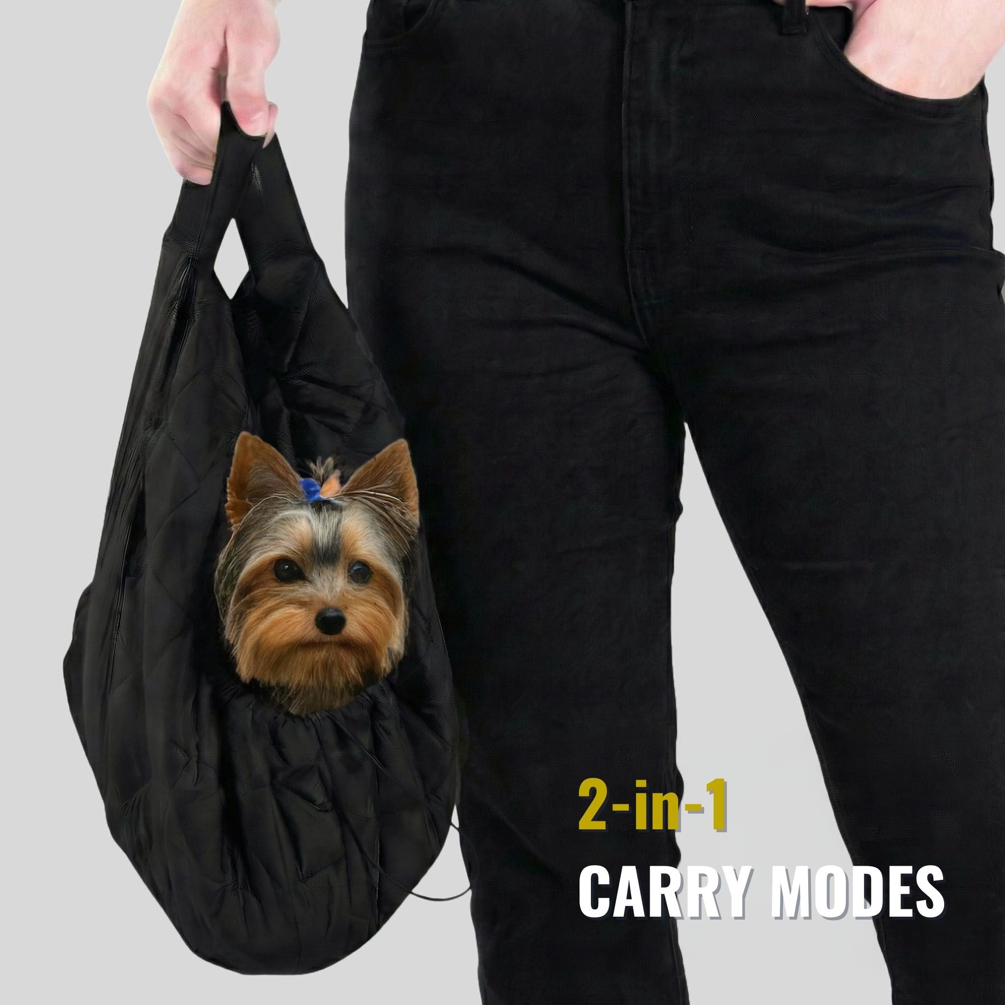 Small dog in black 2-in-1 pet carrier sling bag, person holding handle, text '2-in-1 carry modes'.