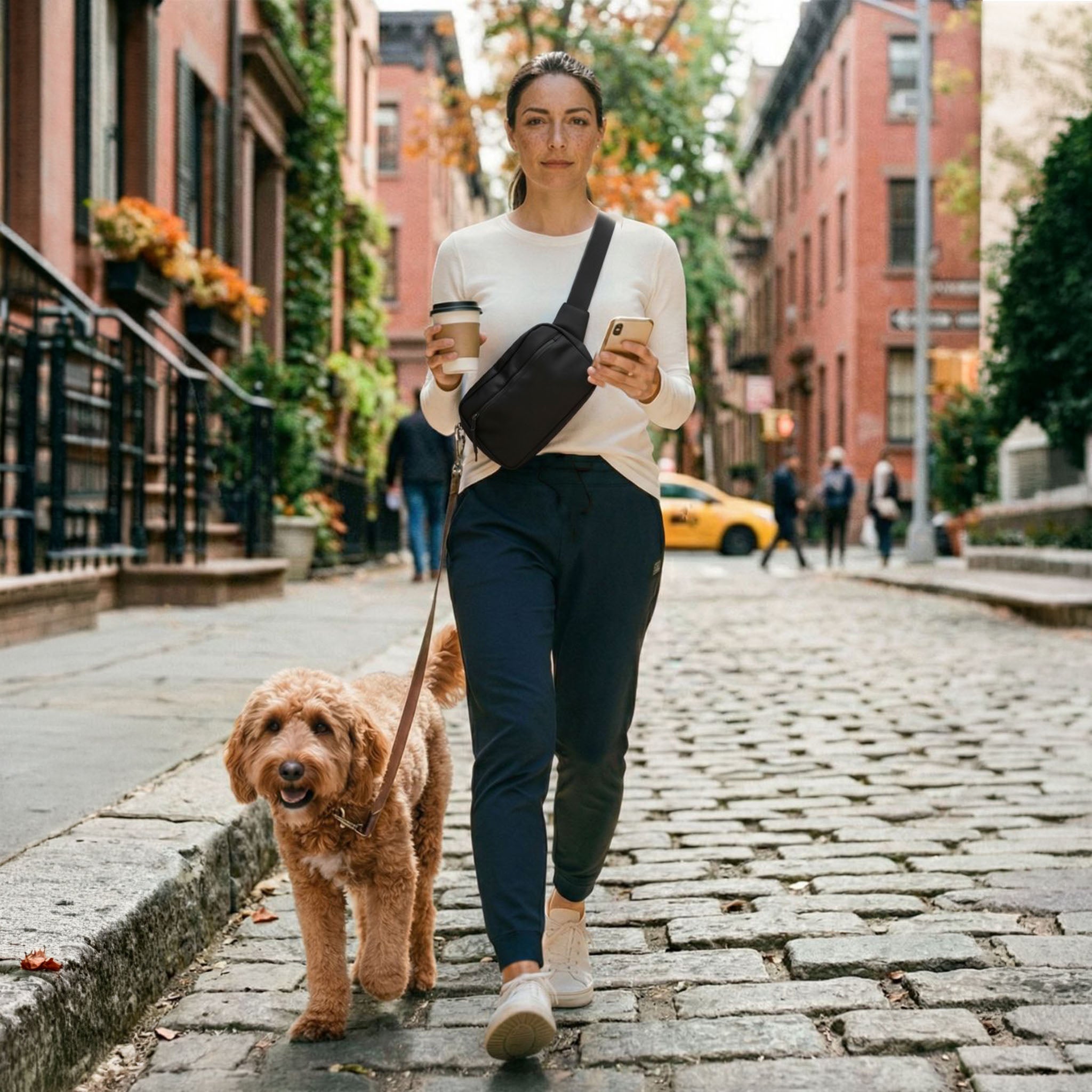 SUSU Grab-n-Go dog walking bag in charcoal black worn crossbody on city street